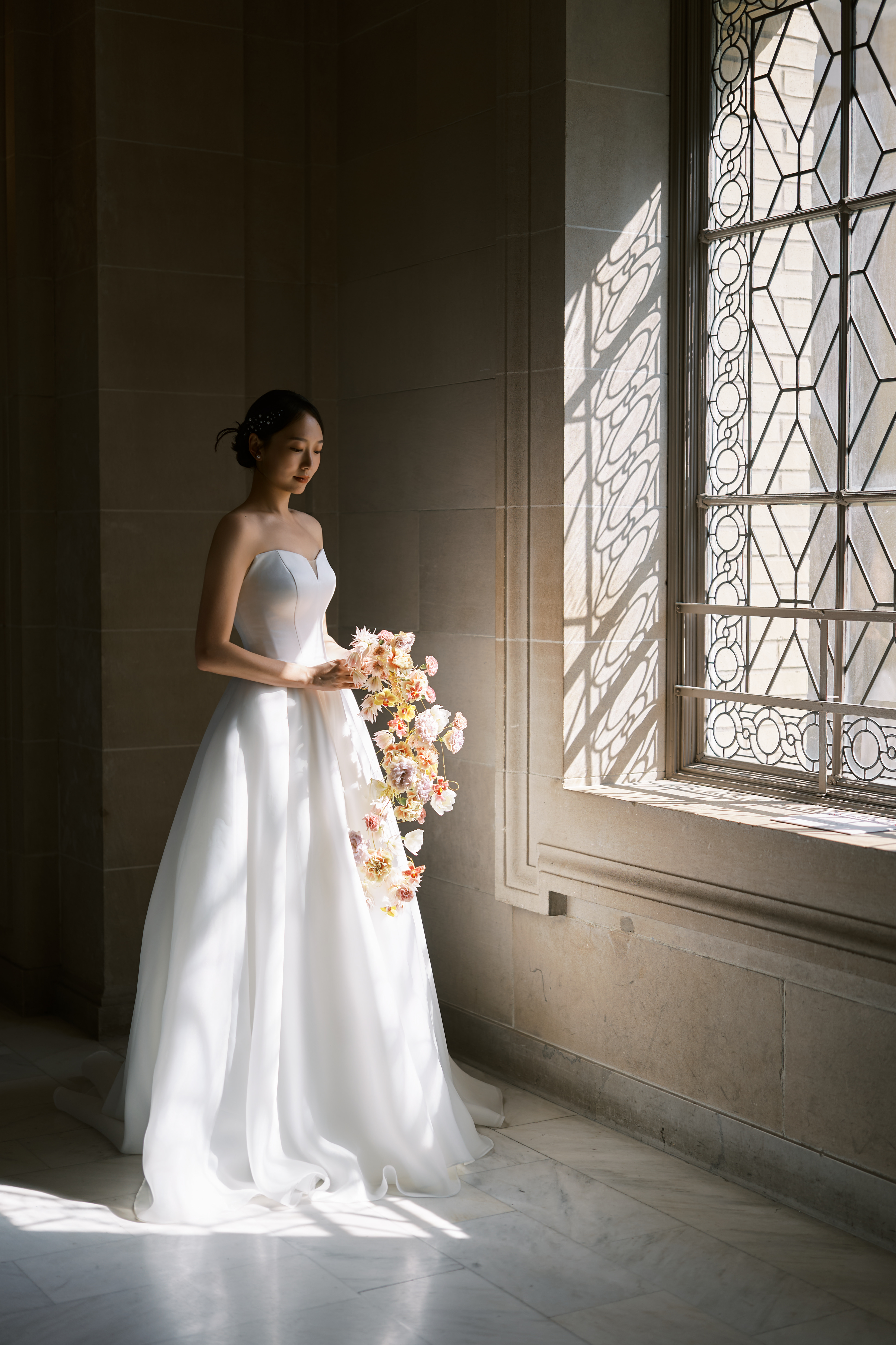 Bride by City Hall window