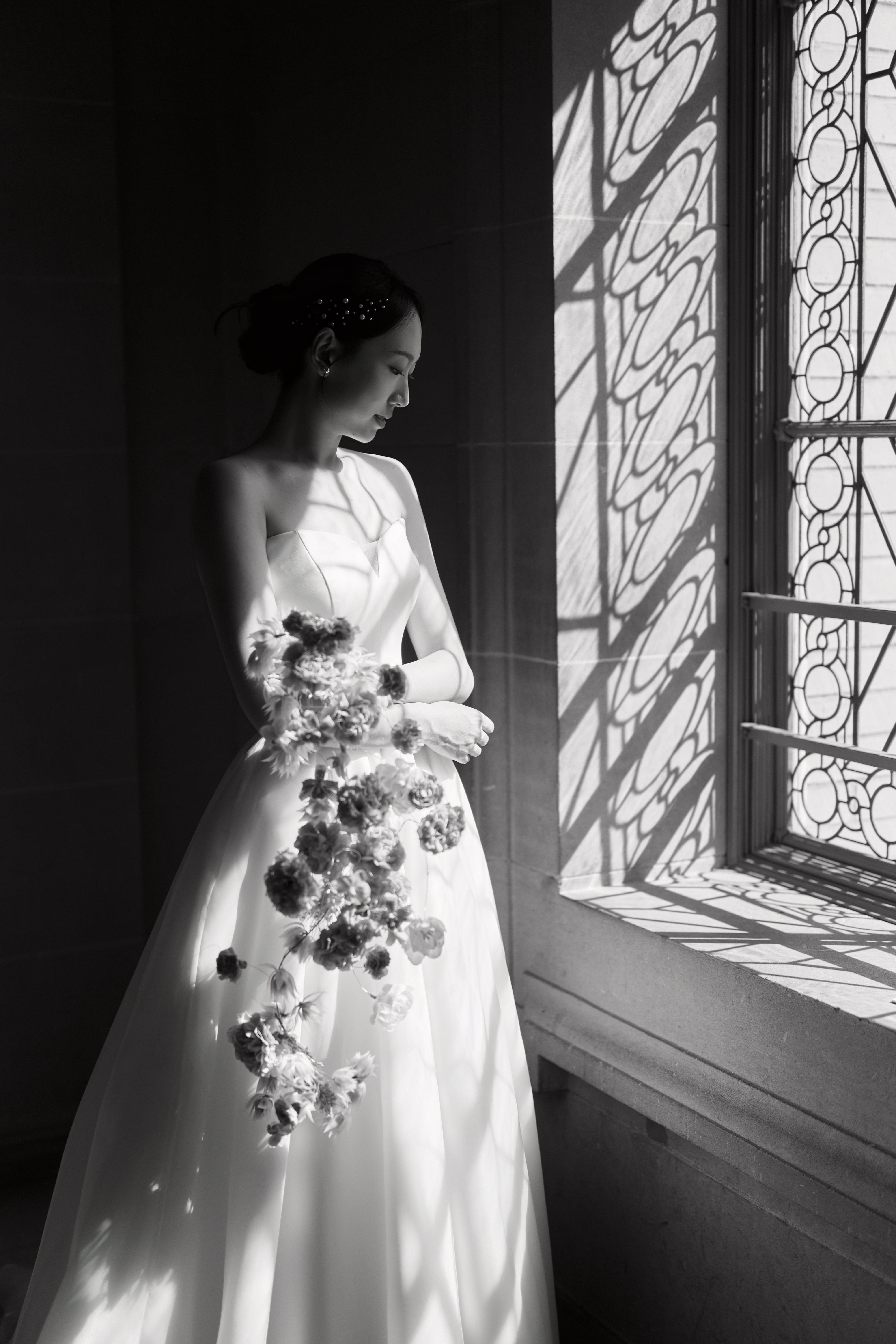 Bride by City Hall window